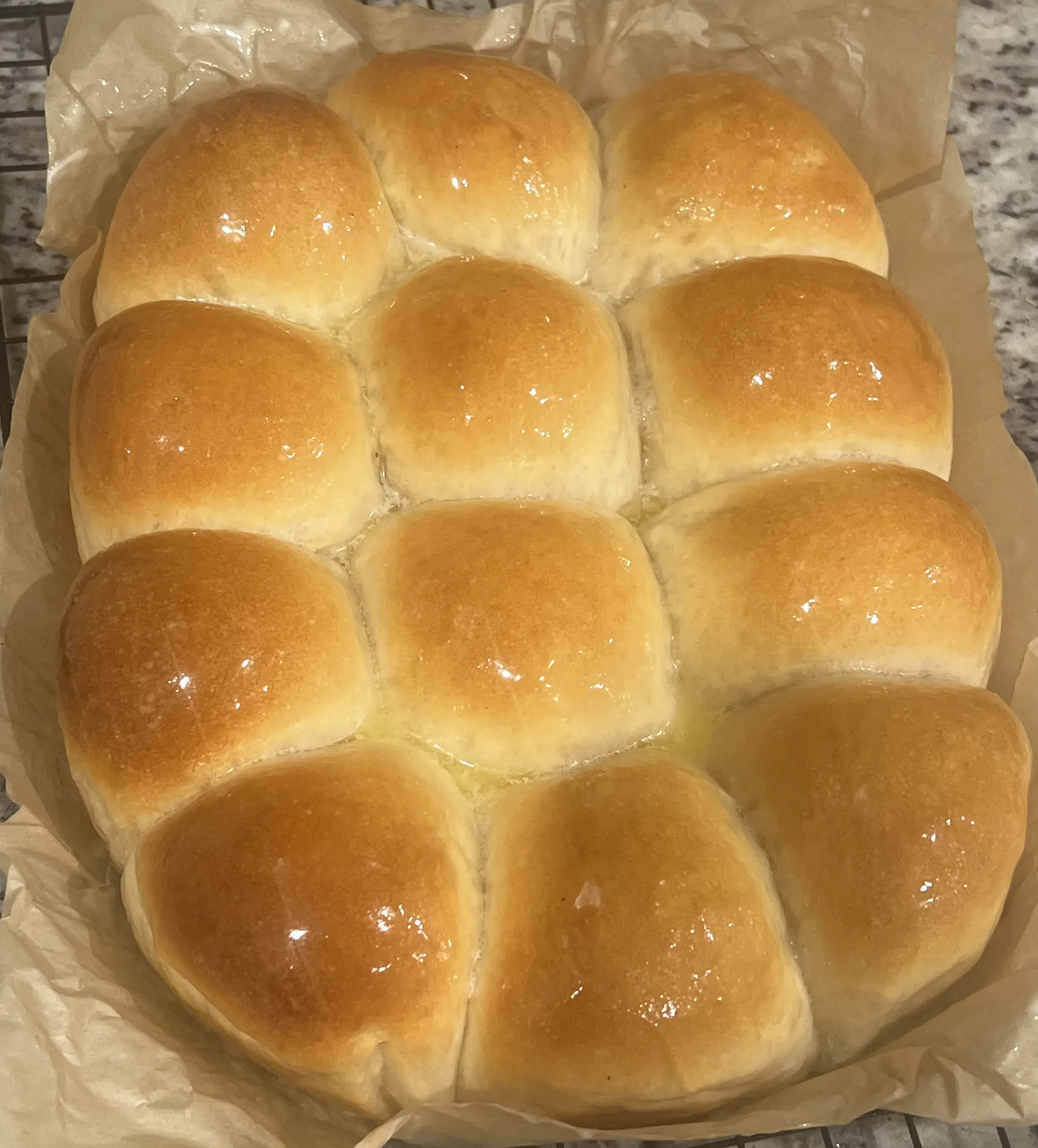 A dozen golden sourdough dinner rolls